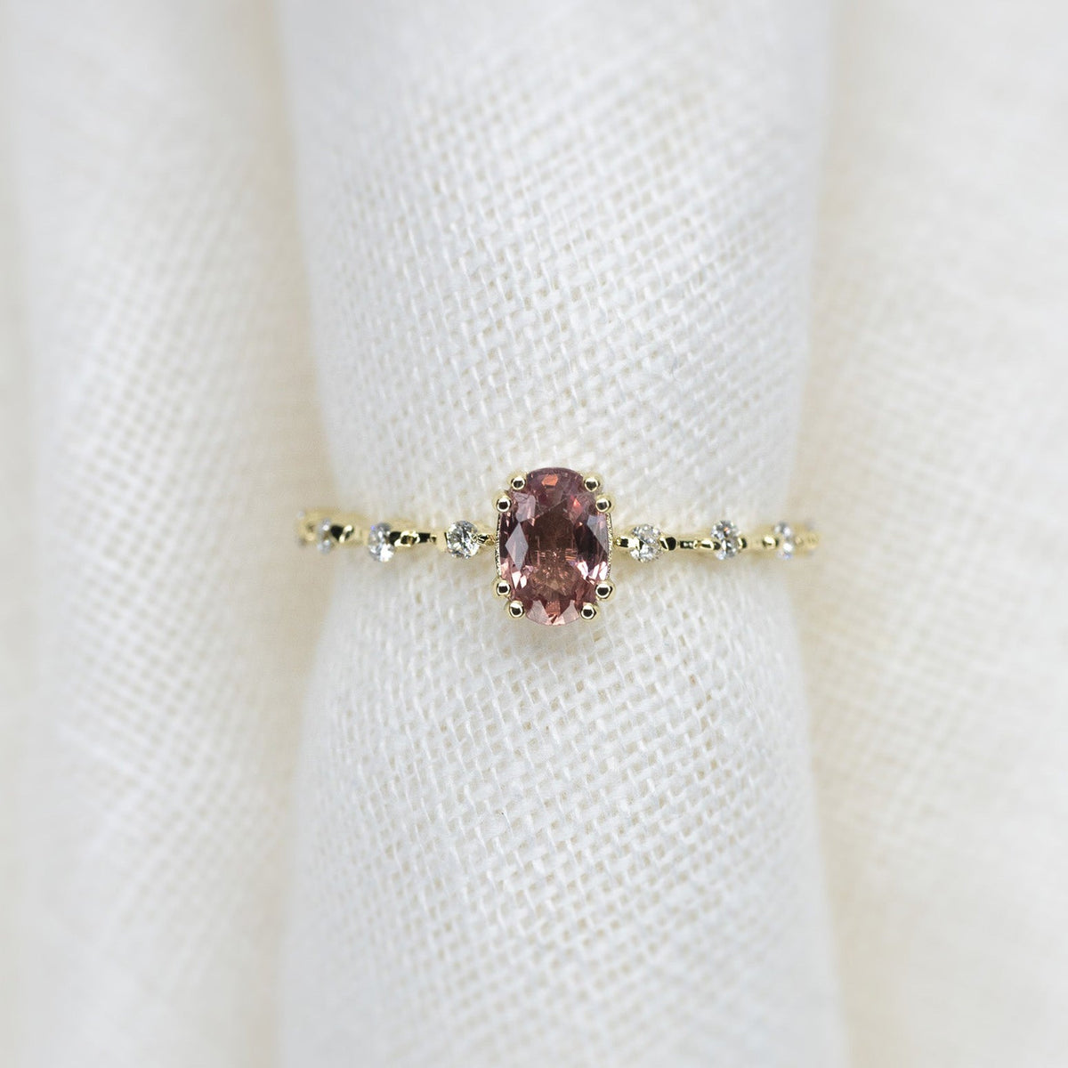 Oval Cut 0.51ct Padparadscha Sapphire Aurora Ice - Lelya - bespoke engagement and wedding rings made in Scotland, UK