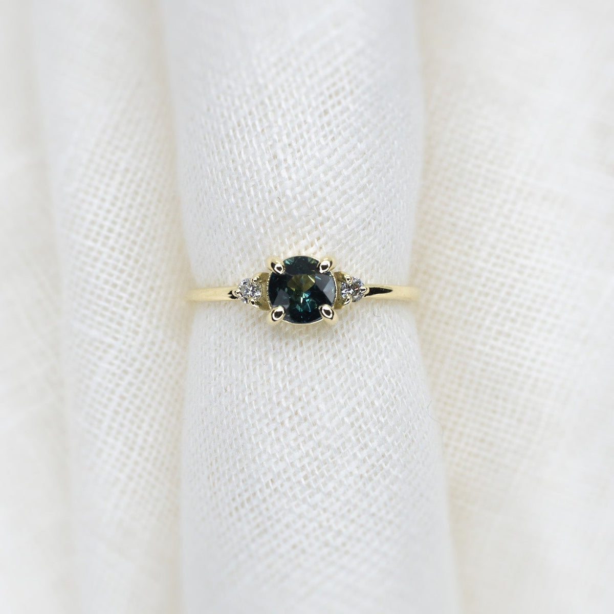 Round Cut 0.77ct Teal Sapphire Halley Triad - Lelya - bespoke engagement and wedding rings made in Scotland, UK